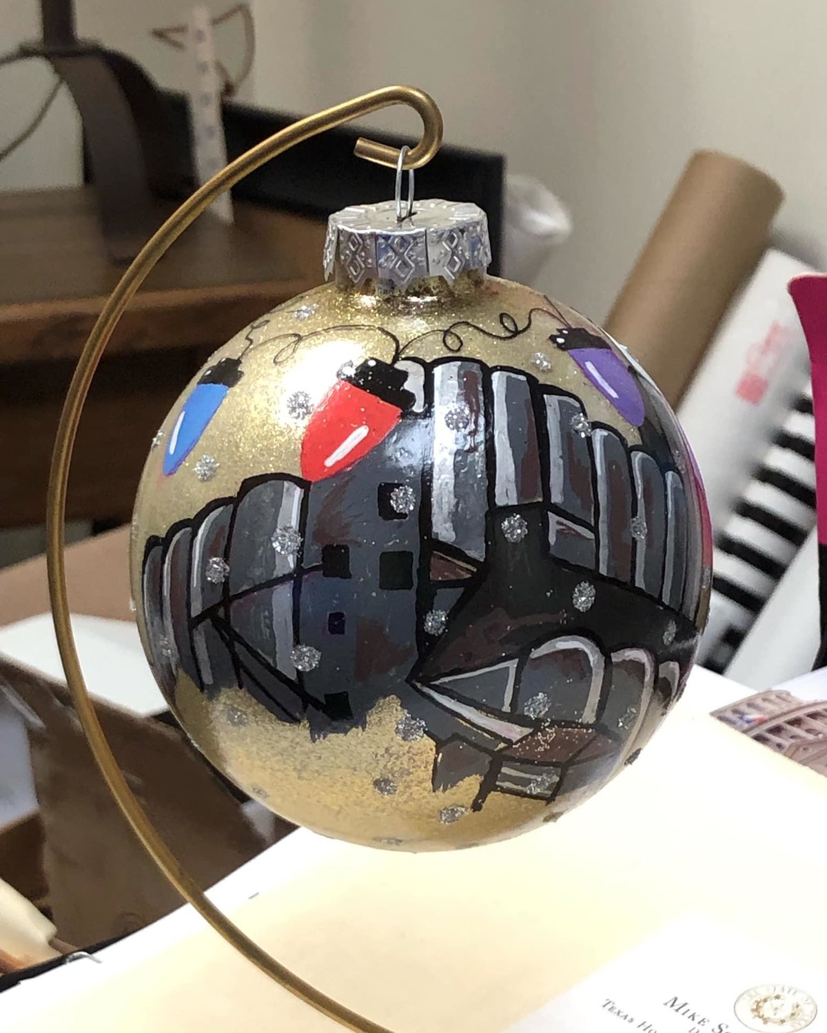 The ornament features an image of a Katy rice dryer.
